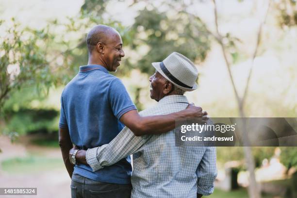 portrait of an elderly father and adult son - fathers day stock pictures, royalty-free photos & images