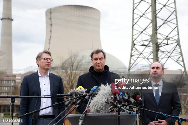 Bavarian state minister Markus Blume, Bavarian Premier Markus Soeder and Bavarian economy minister Hubert Aiwanger addresse the media during a visit...