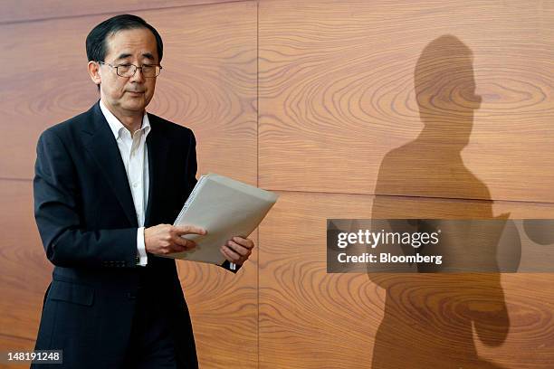 Masaaki Shirakawa, governor of the Bank of Japan, leaves a news conference in Tokyo, Japan, on Thursday, July 12, 2012. The Bank of Japan refrained...