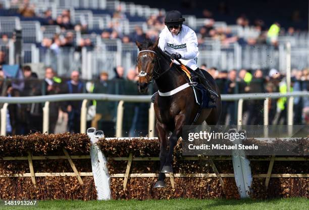 Constitution Hill ridden by Nico de Boinville jumps the last fence as they win the William Hill Aintree Hurdle during the opening day of the Grand...