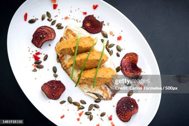 gourmet fusion cuisine fish fillet with spicy curry mashed pumpkin,romania - dining presentation food stock pictures, royalty-free photos & images