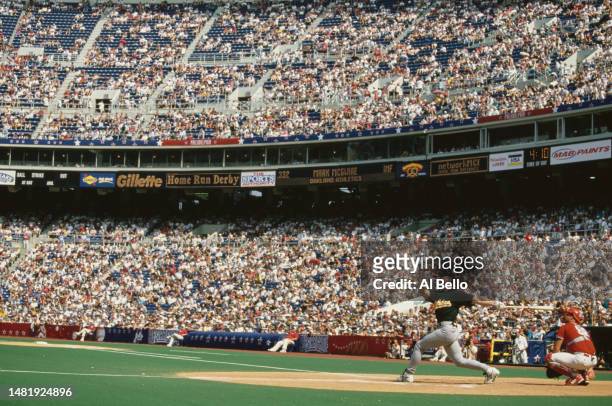 Mark McGwire, First Baseman for the Oakland Athletics and the American League swings at a pitch during the Major League Baseball All Star Home Run...