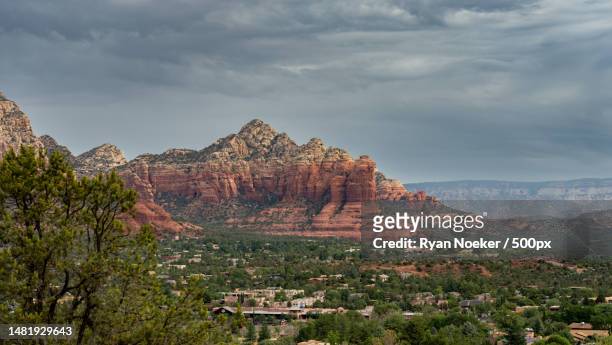 view of rock formations against cloudy sky,sedona,arizona,united states,usa - sightseeing in sedona stock pictures, royalty-free photos & images