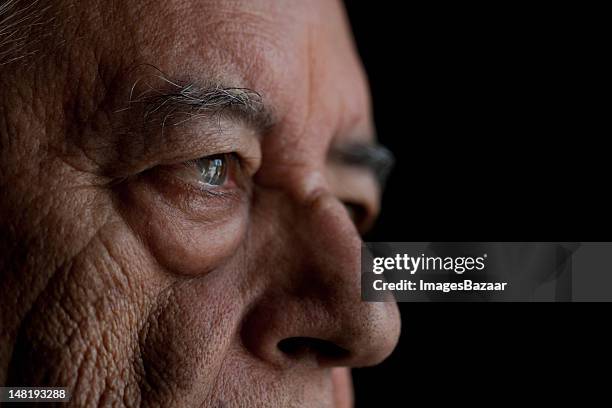 studio shot of senior man, close-up - close up eye man stock pictures, royalty-free photos & images
