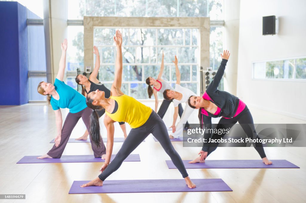 Women exercising together in class