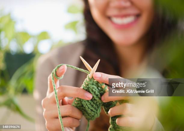 pacific islander woman knitting - stricknadel stock-fotos und bilder