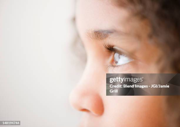 close up of mixed race girl's face - kids side view isolated stockfoto's en -beelden