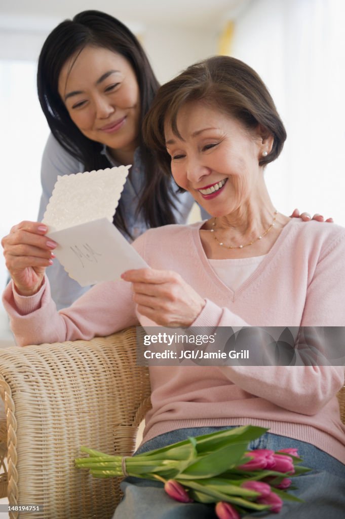Japanese mother reading card from daughter