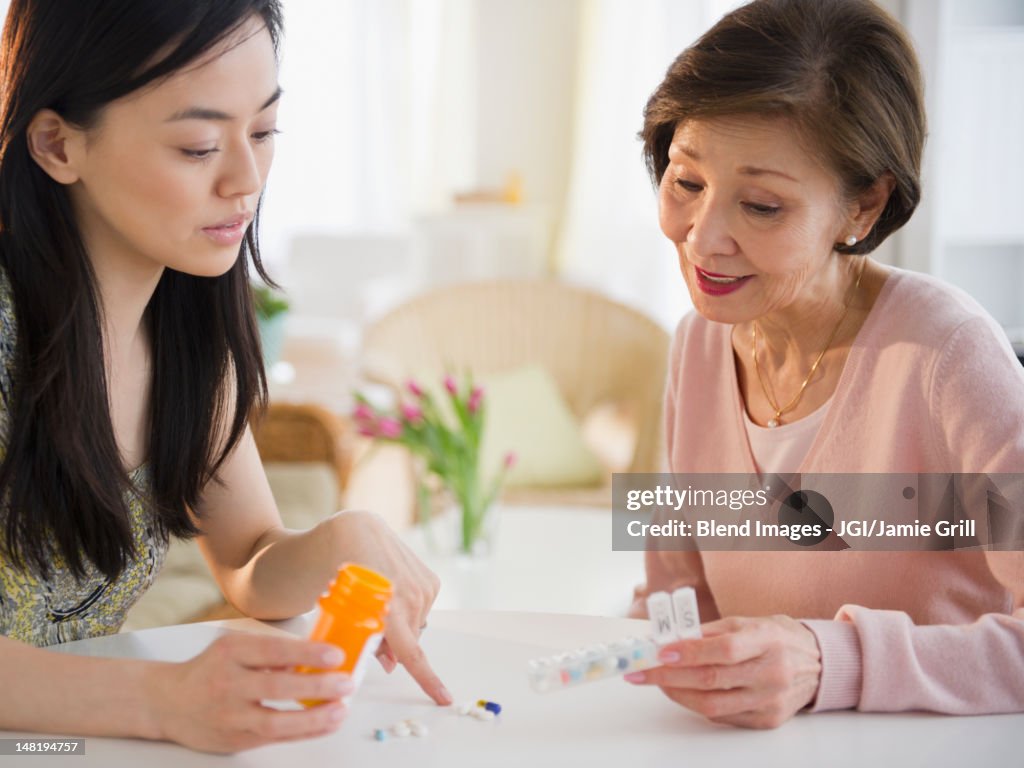 Japanese daughter explaining, medication to mother