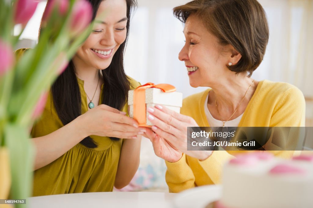 Japanese daughter giving mother gift