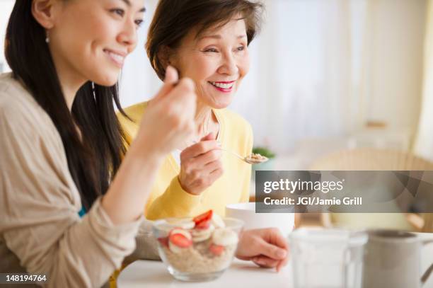 japanese mother and daughter having breakfast together - japanese mother daughter stock pictures, royalty-free photos & images