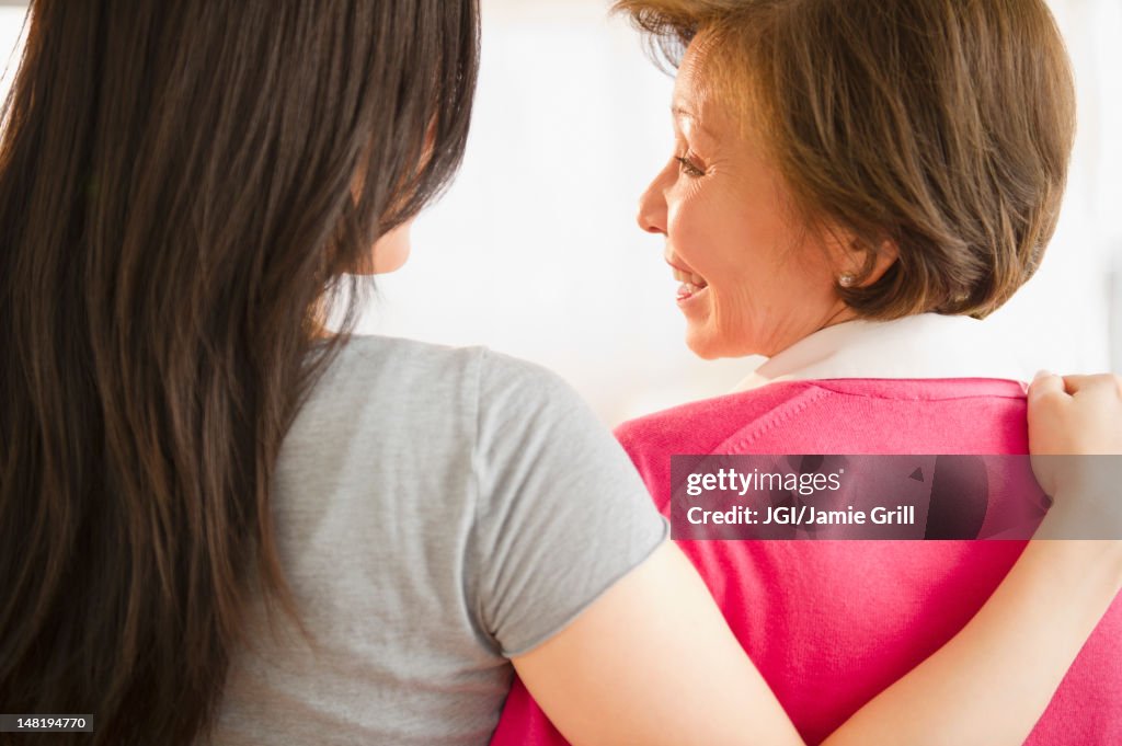 Japanese daughter hugging mother