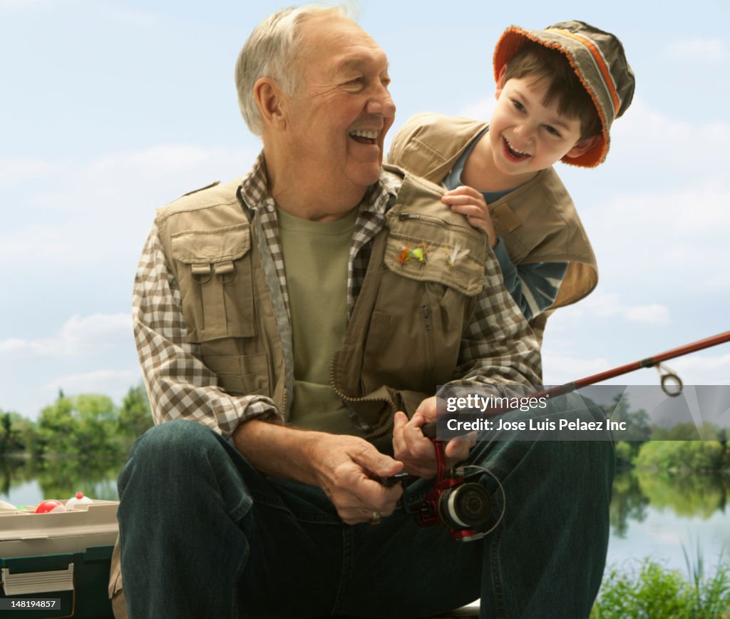 Caucasian grandfather and grandson fishing together