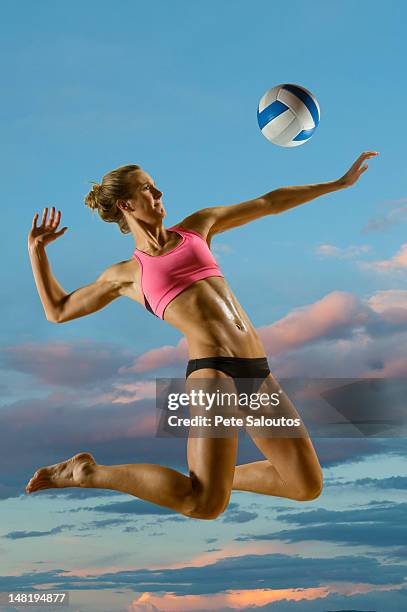 caucasian volleyball player hitting volleyball - spiking stock pictures, royalty-free photos & images