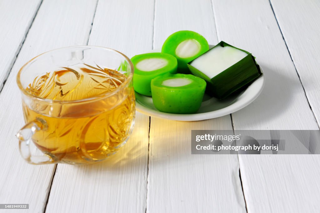 A cup of hot tea and Kuih muih