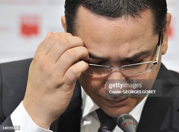 Romanian Prime Minister Victor Ponta gestures during a press conference at the Residence Palace, near the European Union Headquarters, in Brussels on...