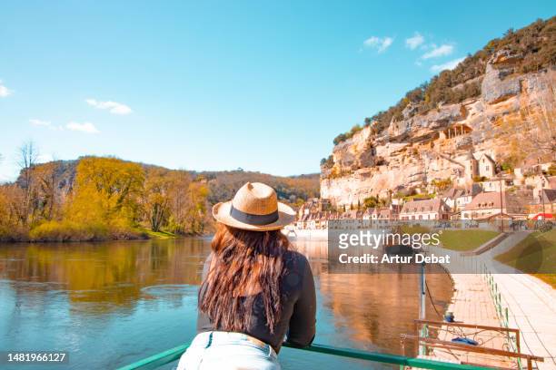 traveler woman with straw hat in picturesque town in the south of france in the perigord region. - ドルドーニュ ストックフォトと画像