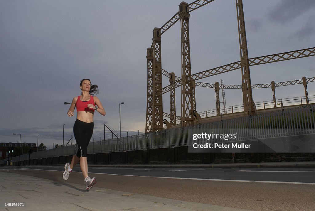 Runner jogging on city street