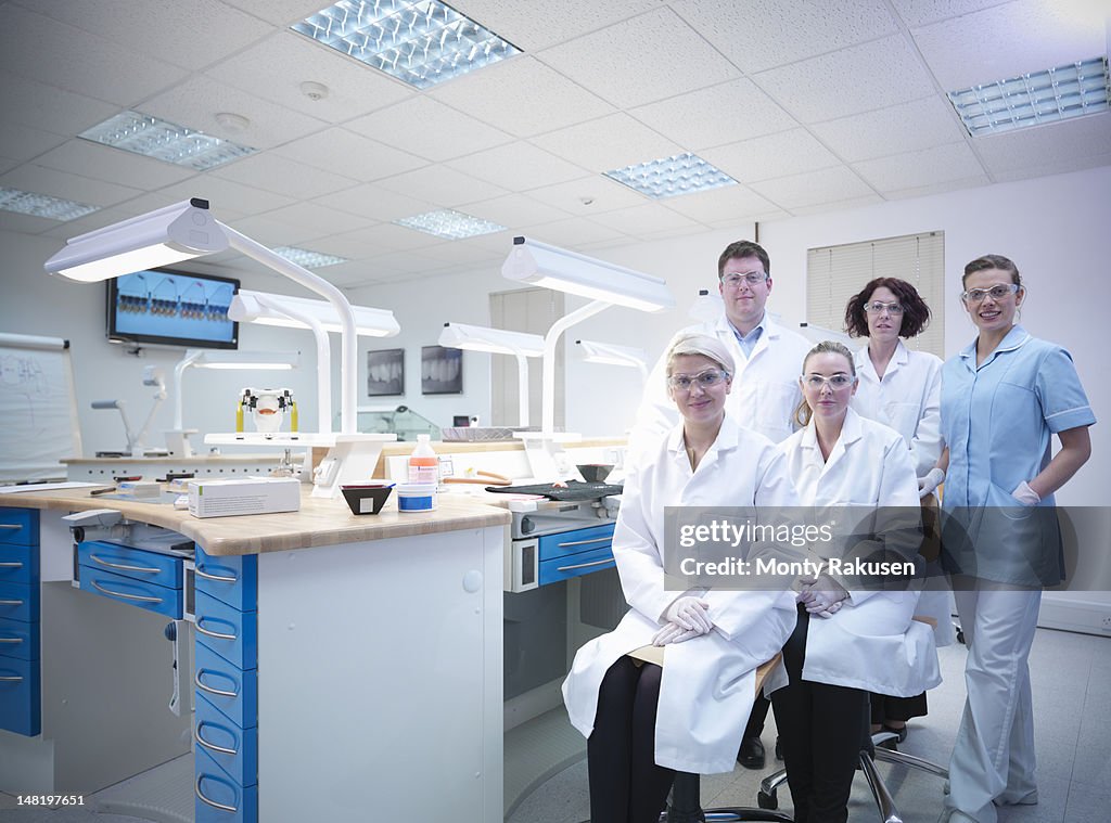 Professional dentists and apprentices in dental laboratory