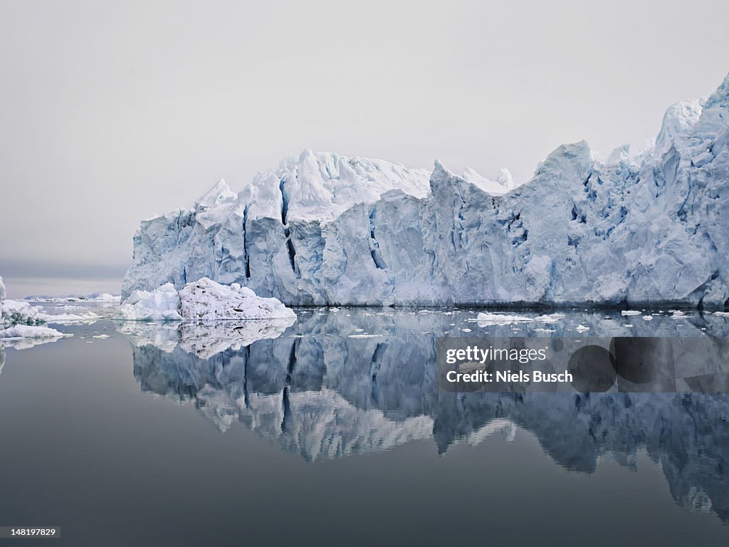 Glacier reflected in still lake