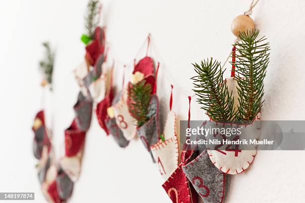 close up of advent calendar on wall - advent calendar stock pictures, royalty-free photos & images