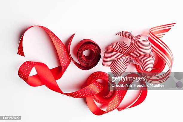 close up of decorative red ribbons - roll of wrapping paper stock pictures, royalty-free photos & images