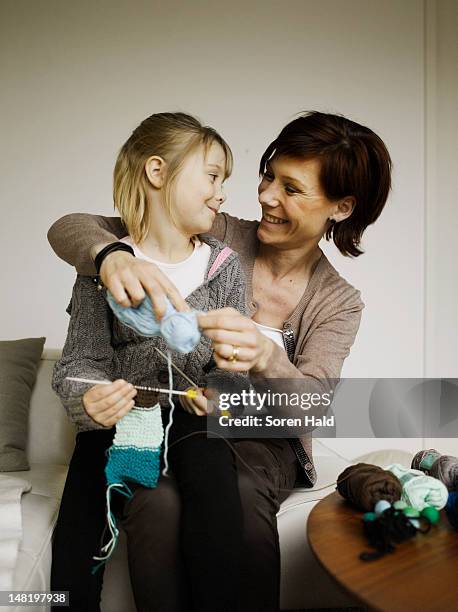 mother and daughter knitting together - child knitting stock pictures, royalty-free photos & images
