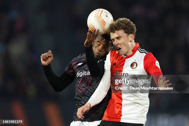 Georginio Wijnaldum of AS Roma and Mats Wieffer of Feyenoord battle for a header during the UEFA Europa League quarterfinal first leg match between...