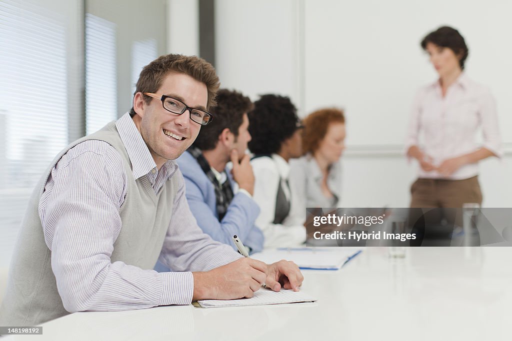 Businessman making notes in meeting