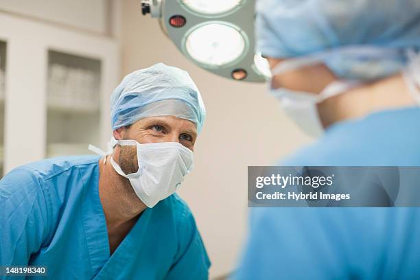 veterinary surgeons working together - doctor partnership stock pictures, royalty-free photos & images