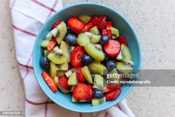 high angle view of fruits on plate - bol foto e immagini stock
