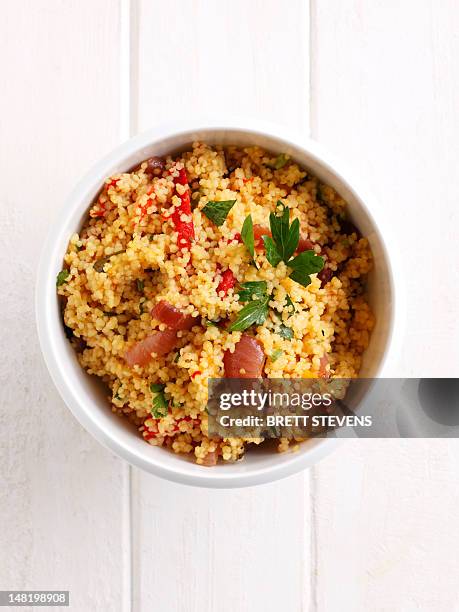 close up of bowl of couscous - クスクス ストックフォトと画像