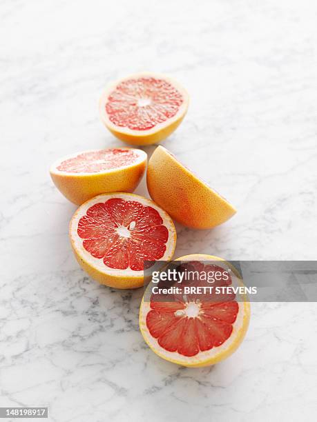 close up of grapefruit halves - grapefruit stock pictures, royalty-free photos & images
