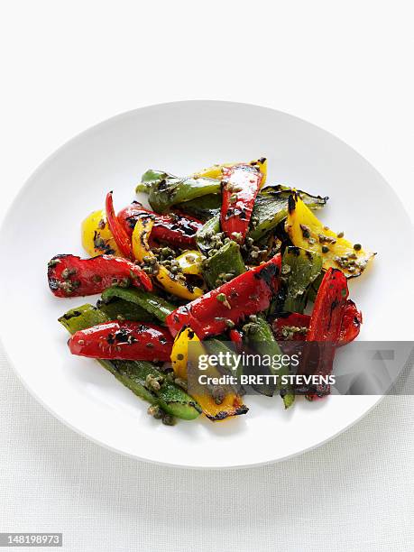 close up of plate of grilled peppers - roasted pepper stock pictures, royalty-free photos & images