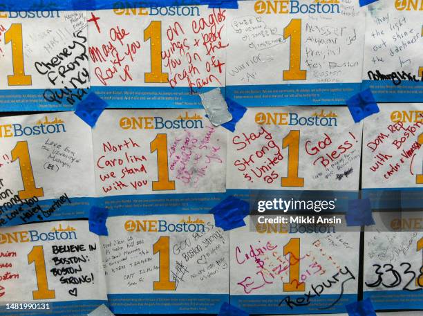 Close-up of messages written on 'One Boston' leaflets and posted at a memorial for the victims of the Boston Marathon Bombing , Copley Square,...