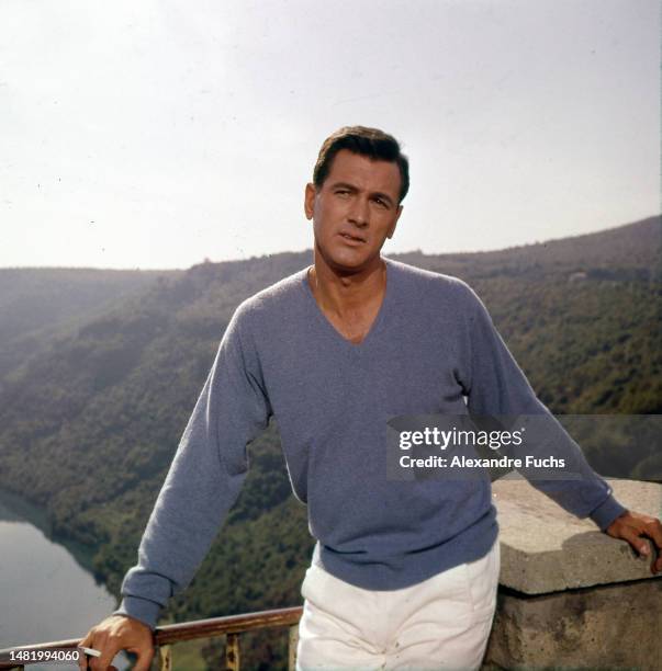 Actor Rock Hudson poses for a portrait wearing a blue sweater at Portofino, Italy, in 1960.