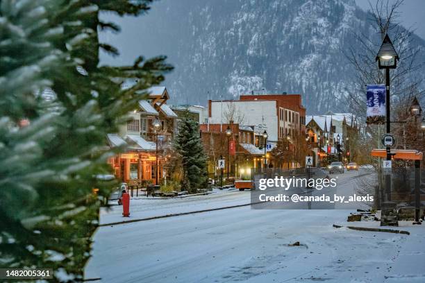 banff snowy town centre scene - banff springs hotel stock pictures, royalty-free photos & images