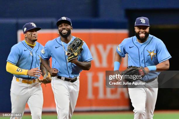 Wander Franco, Randy Arozarena, and Manuel Margot of the Tampa Bay Rays run off the field after defeating the Boston Red Sox 9-3 at Tropicana Field...