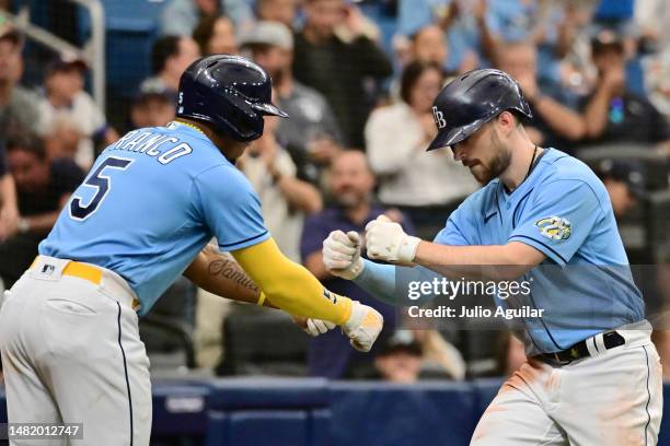 Brandon Lowe celebrates with Wander Franco of the Tampa Bay Rays after hitting a home run in the seventh inning against the Boston Red Sox at...