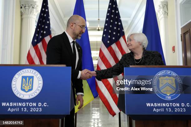 Secretary of the Treasury Janet Yellen and Ukraine Prime Minister Denys Shmyhal shake hands after a bilateral meeting during the annual Spring...