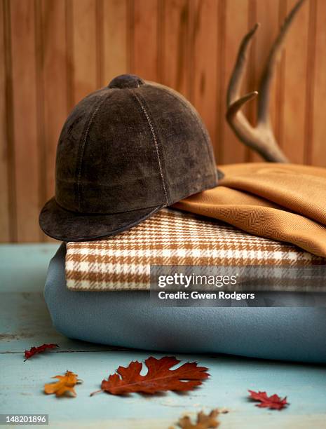 still life of a horseback riding cap. - reitsport-veranstaltung stock-fotos und bilder