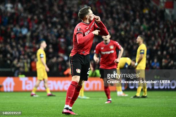 Florian Wirtz of Bayer 04 Leverkusen celebrates after scoring the team's first goal during the UEFA Europa League quarterfinal first leg match...