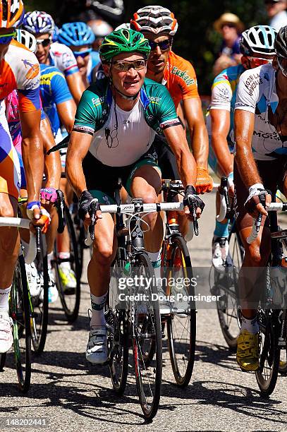 Thomas Voeckler of France riding for Europcar rides in the breakaway group on the Col du Grand Colombier as he went on to win stage ten of the 2012...