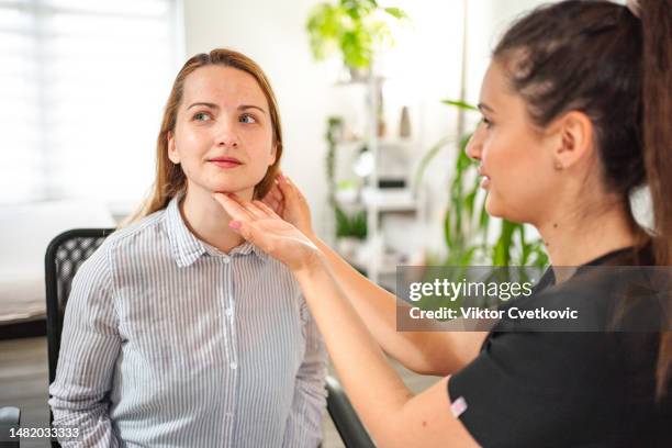 cosmetologist preparing patient for facial treatments - dermatologists talking to each other patient stock pictures, royalty-free photos & images
