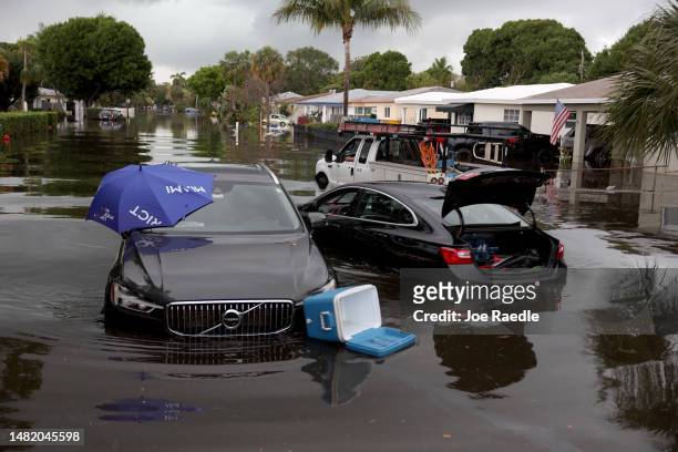 Abandoned vehicles sit in a flooded street on April 13, 2023 in Fort Lauderdale, Florida. Nearly 26 inches of rain fell on Fort Lauderdale over a...