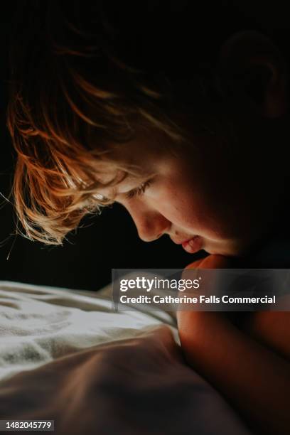 a child looks down - emotional intelligence stock pictures, royalty-free photos & images