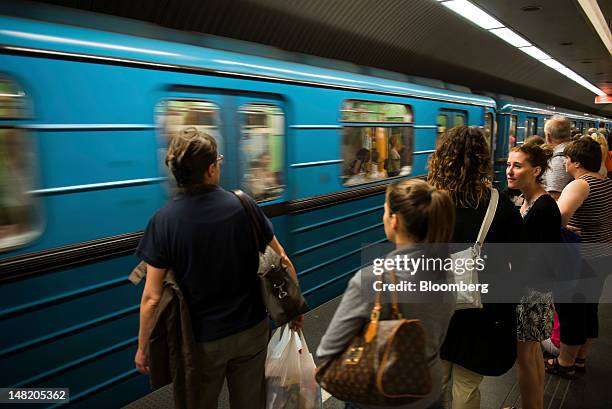 Pedestrians wait to board a subway train at Deak Square in Budapest, Hungary, on Thursday, July 12, 2012. Hungary's start on international aid talks...