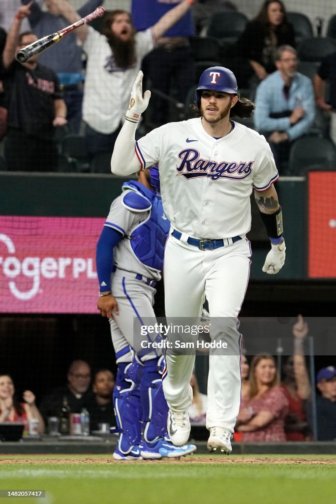 Texas Ranger Heim Jonah Heim of the Texas Rangers flips his bat after hitting a... News ...