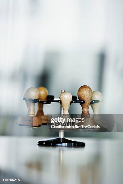 rack with old fashioned office stamps - ständer stock-fotos und bilder