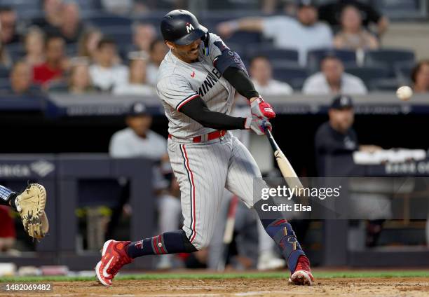 Carlos Correa of the Minnesota Twins hits a home run in the first inning against the New York Yankees at Yankee Stadium on April 13, 2023 in Bronx...